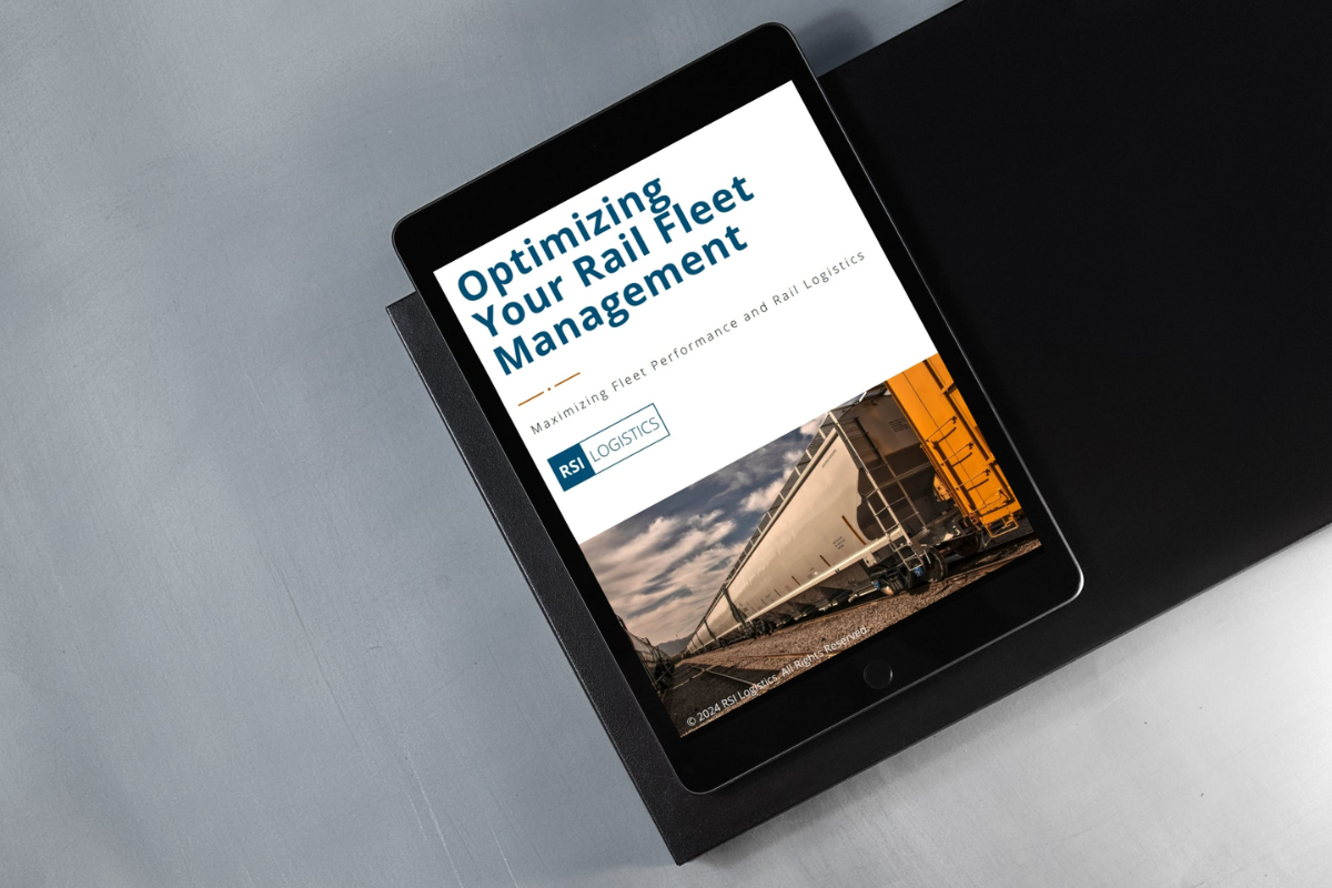 The eBook optimizing your rail fleet management displayed on a tablet.