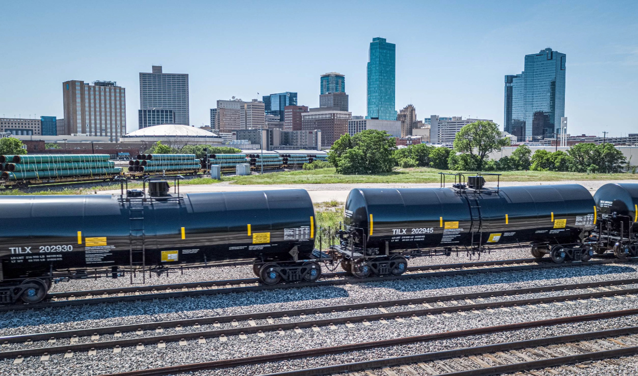 eBook cover of black and yellow rail freight tank cars in front of city skyline eBook cover of black and yellow rail freight tank cars in front of city skyline